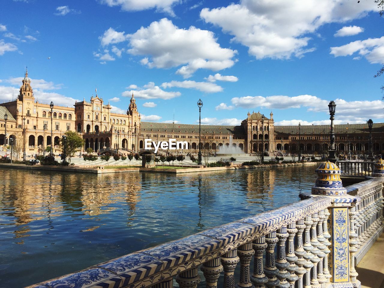 Canal by plaza de espana against sky