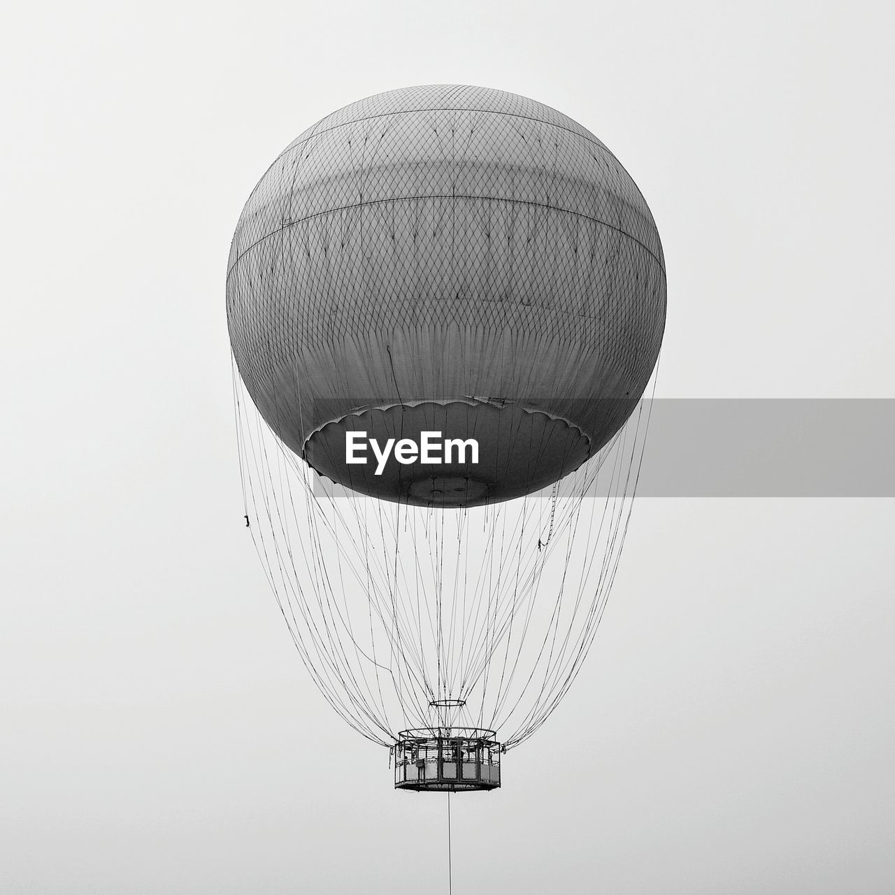 Low angle view of hot air balloon flying against clear sky