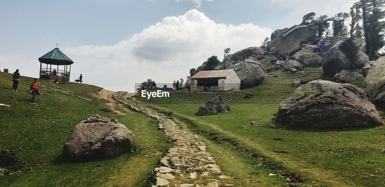 PANORAMIC VIEW OF LAND AND BUILDING AGAINST SKY