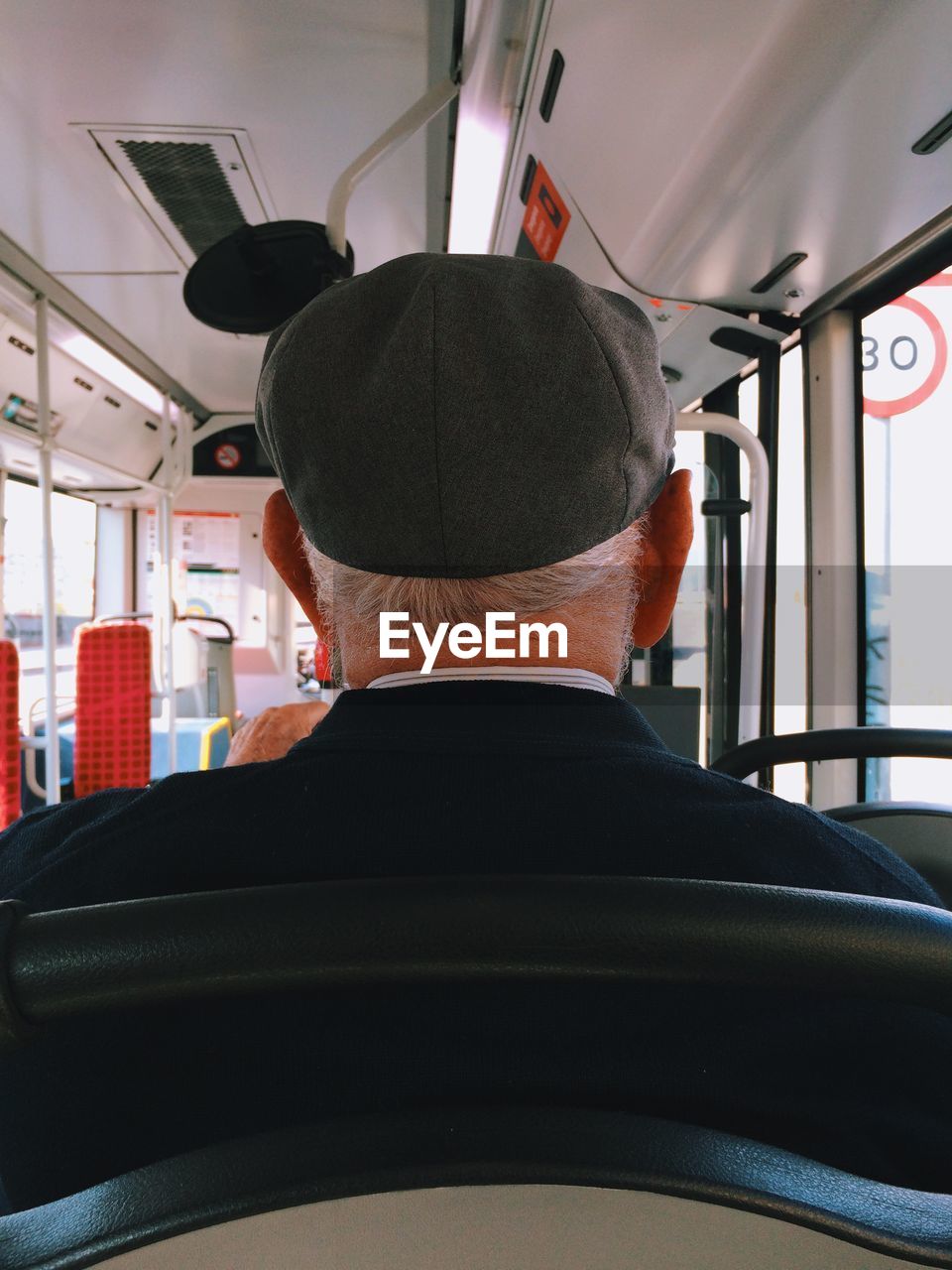 Senior man travelling in bus