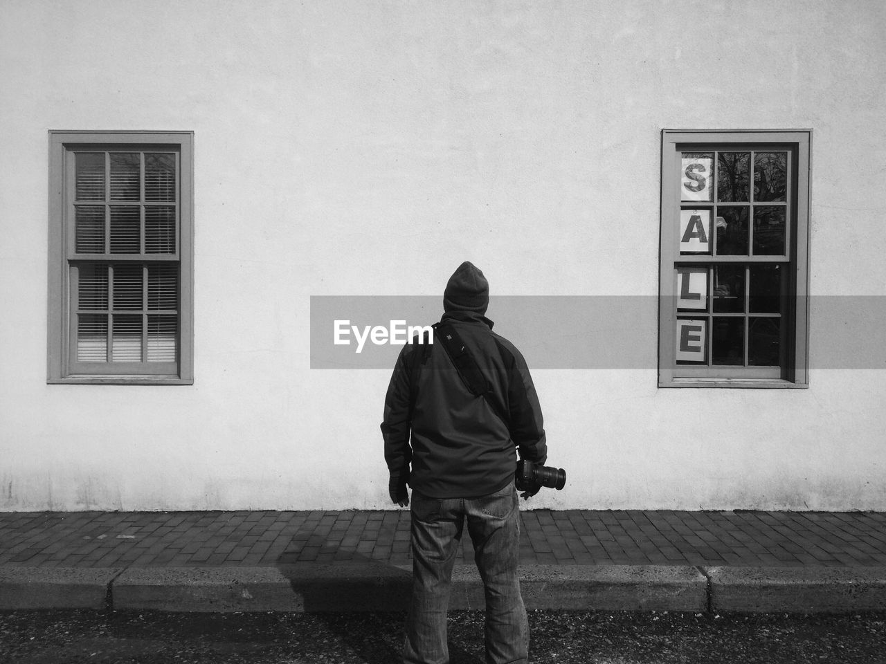 Rear view of a male photographer