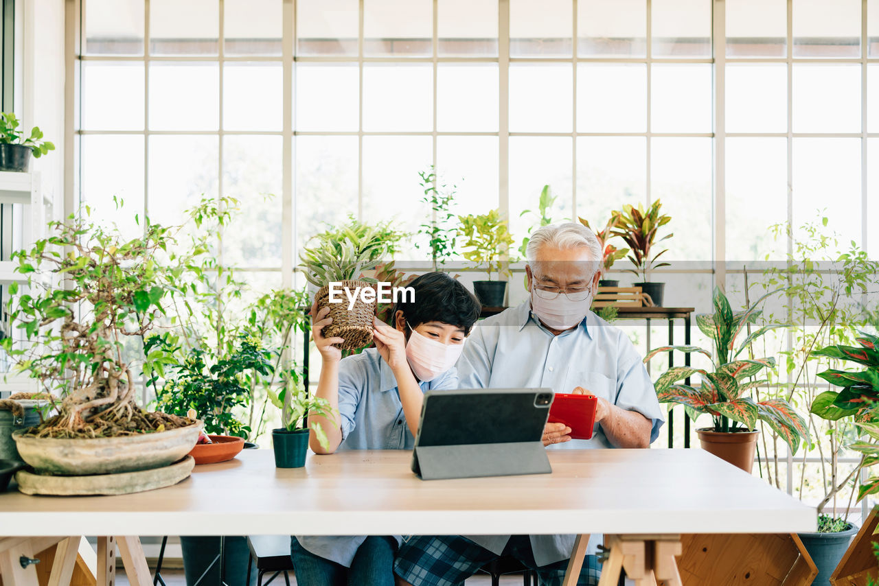 People sitting on table at home