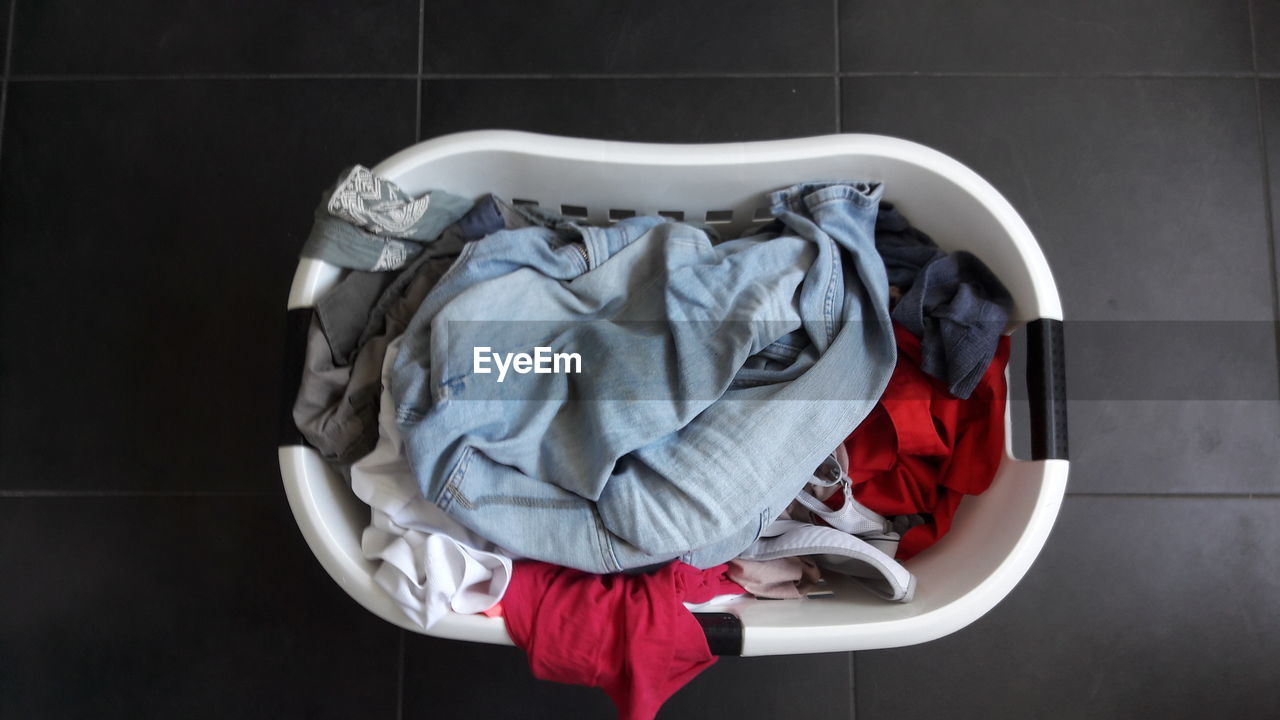 High angle view of clothes in basket on floor