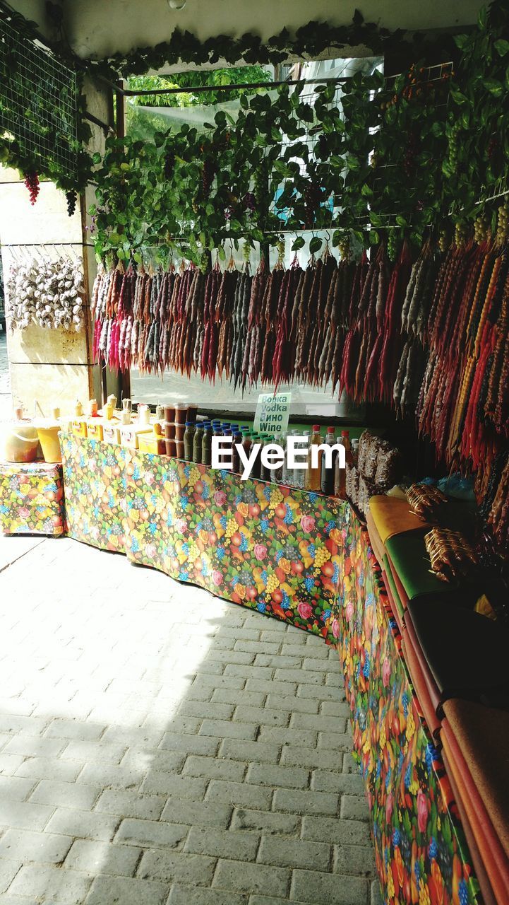 MULTI COLORED CHAIRS IN WATER AT MARKET