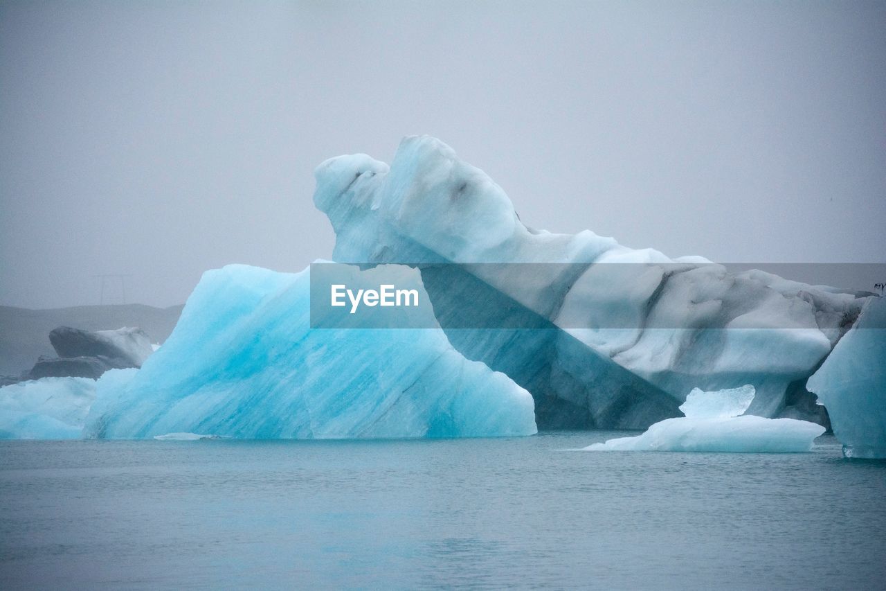 Scenic view of frozen lake against sky