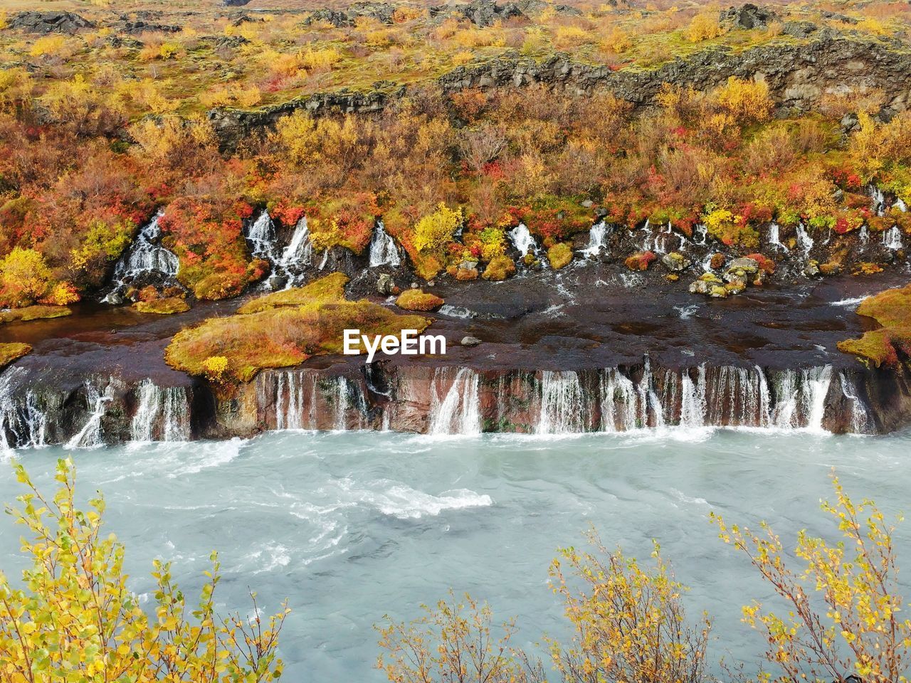 Hraunfossar waterfall with fall colors