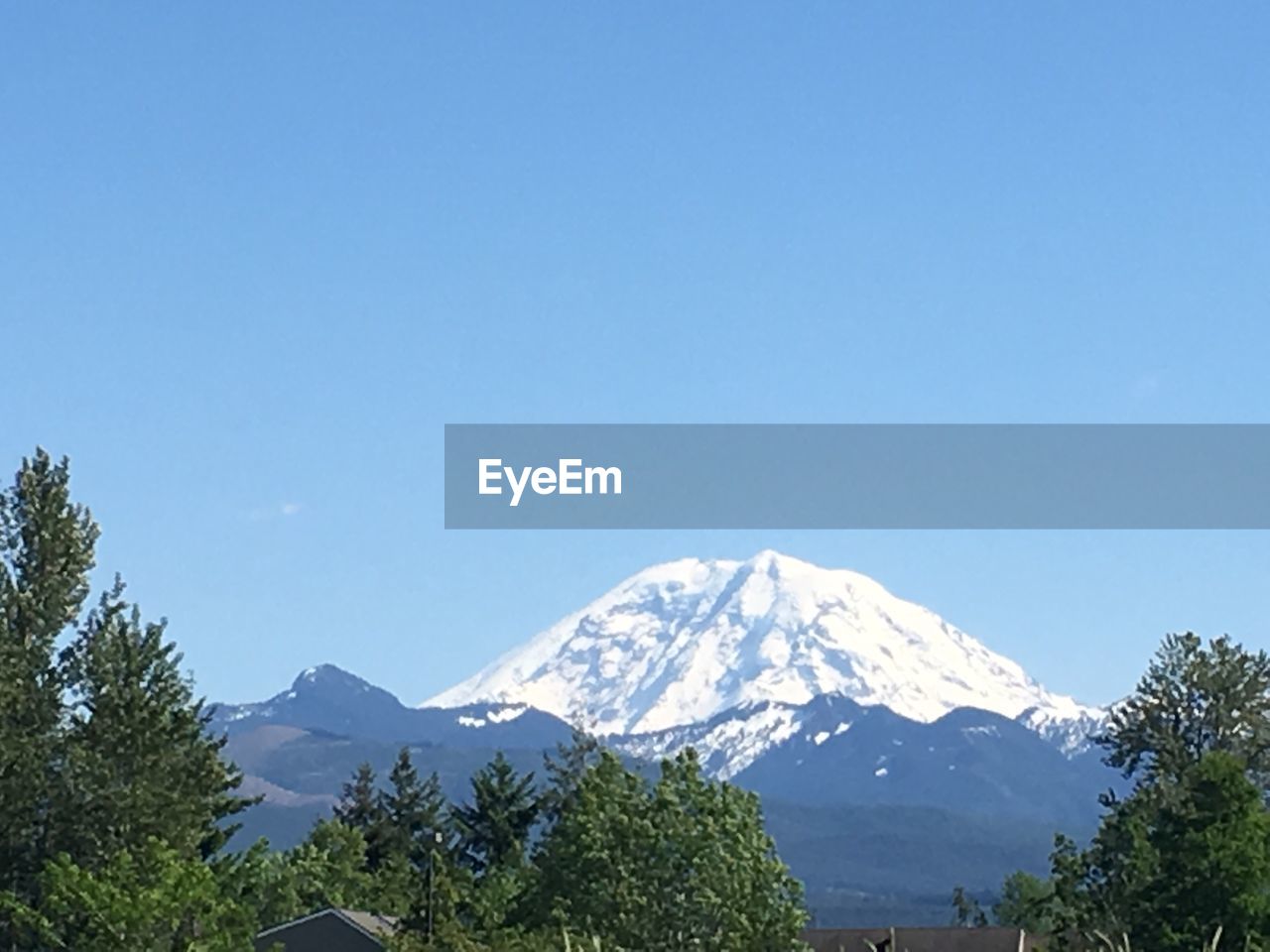 SCENIC VIEW OF MOUNTAINS AGAINST BLUE SKY