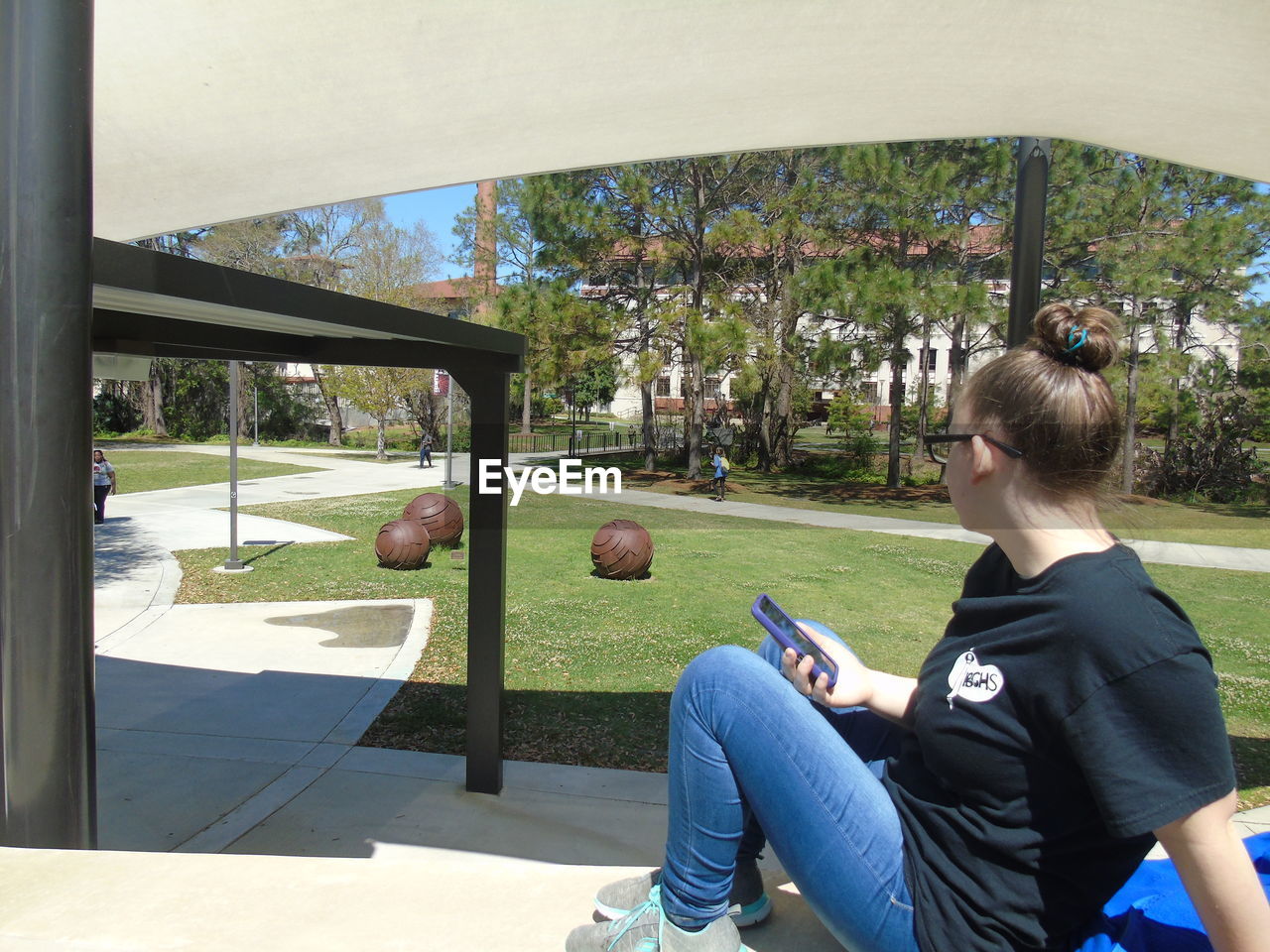 WOMAN SITTING ON BENCH