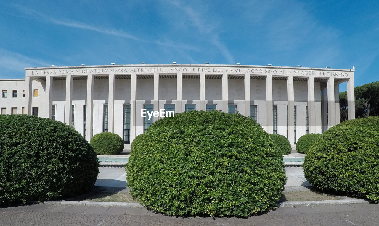 VIEW OF FORMAL GARDEN AGAINST BUILDING