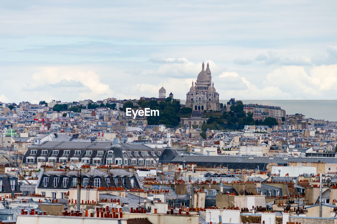 Paris cityscape from above. montmartre hill and sacre coer church stand out in the view