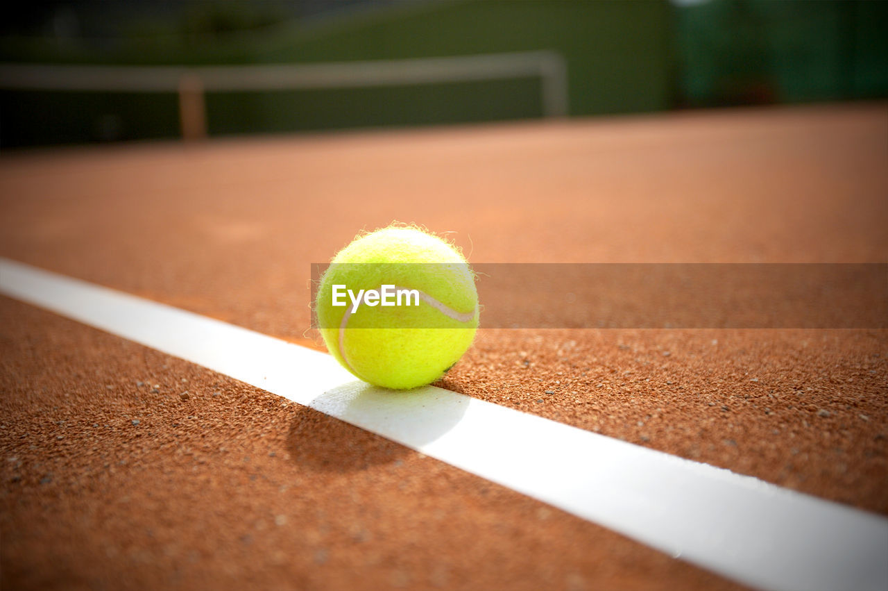 Close-up of ball on tennis court