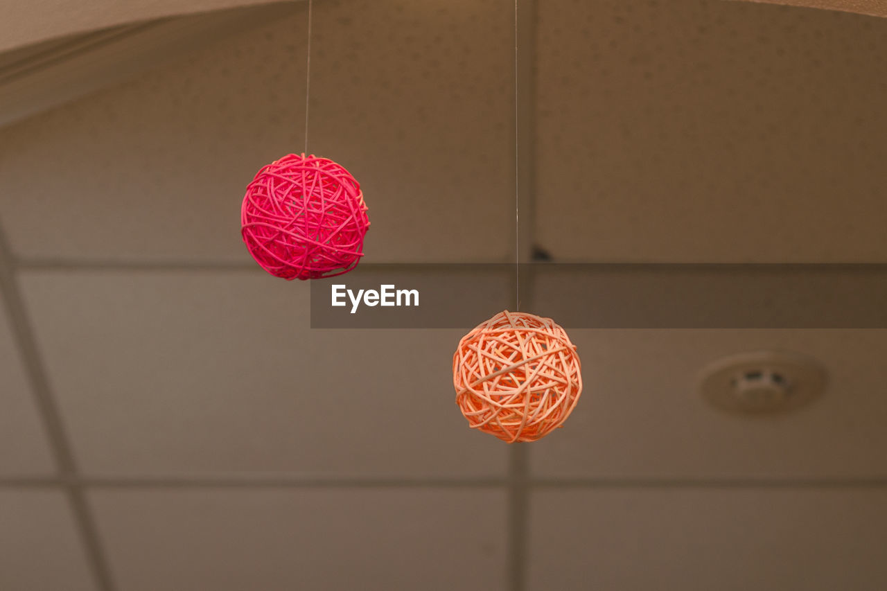 LOW ANGLE VIEW OF LANTERNS HANGING ON CEILING