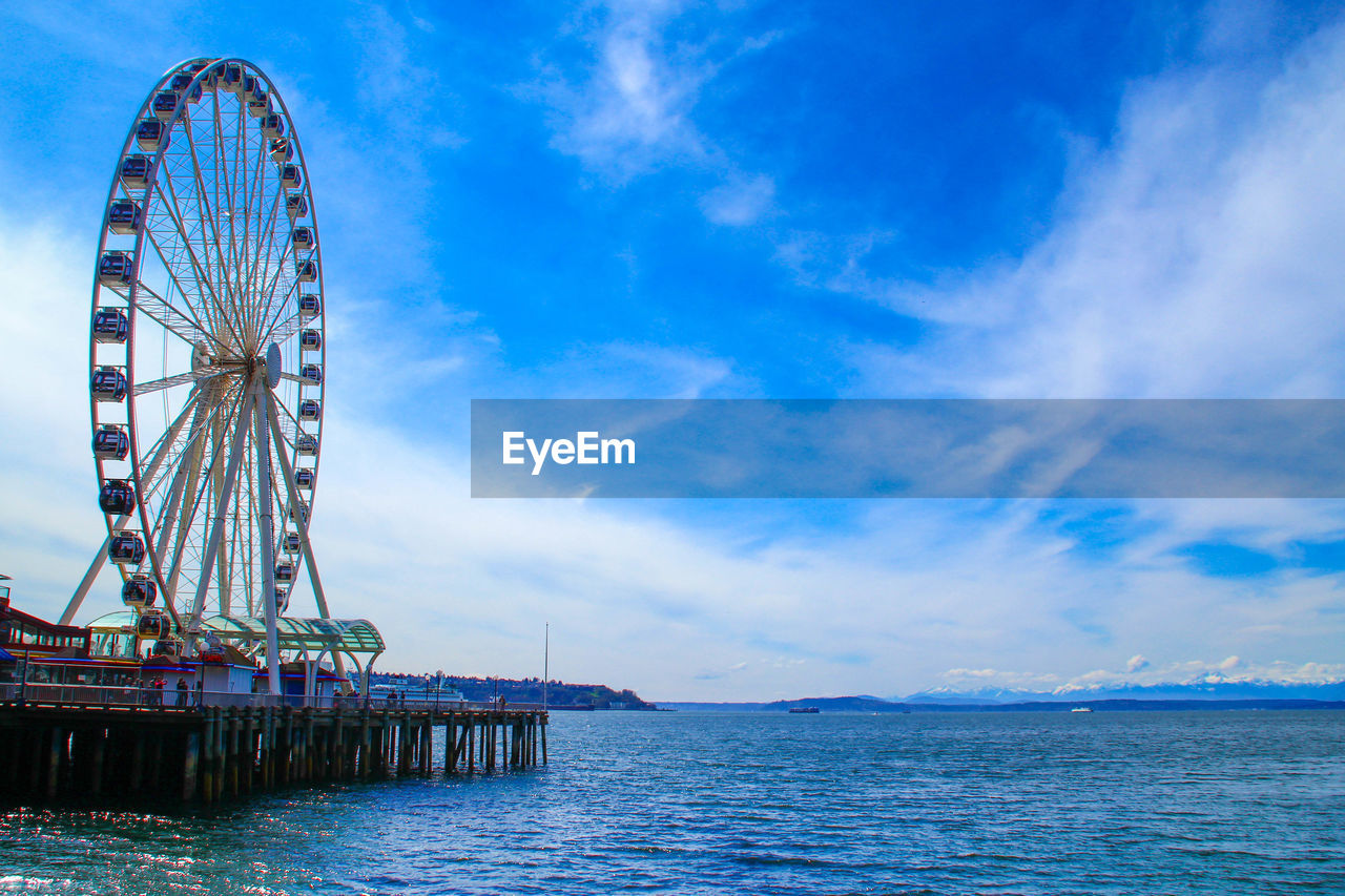 FERRIS WHEEL AGAINST SKY