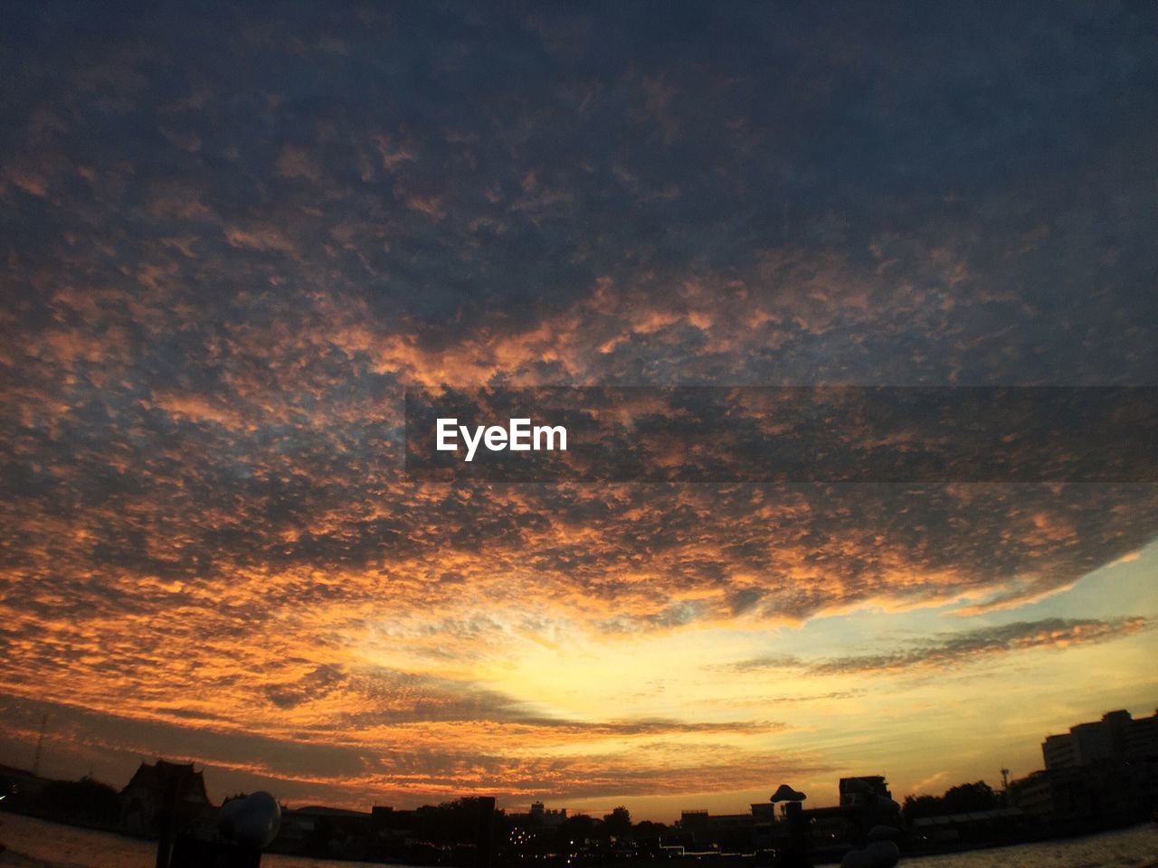 Scenic view of dramatic sky during sunset