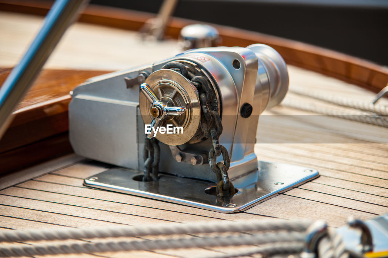 The anchor winch of a hand made wooden boat. 
