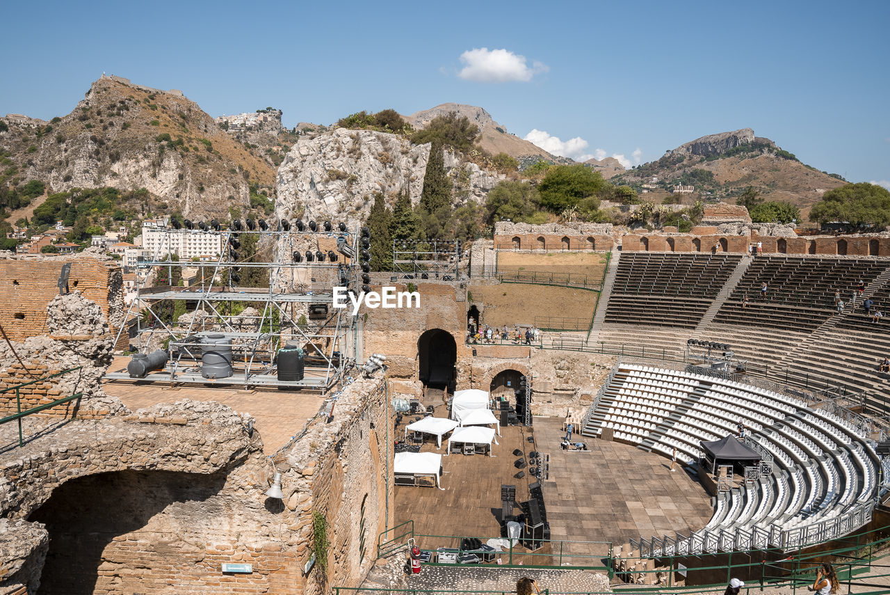 Panoramic view of old ruins of ancient greek theater at mediterranean seacoast