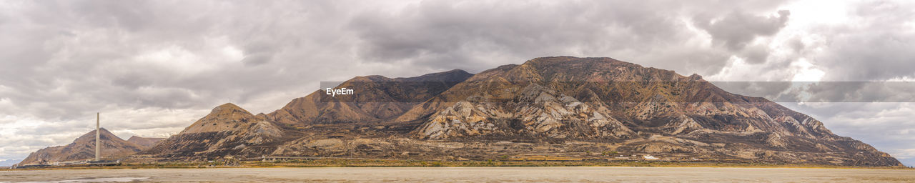 PANORAMIC VIEW OF ROCKY MOUNTAINS AGAINST SKY