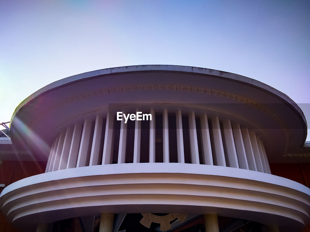 Low angle view of building against clear blue sky