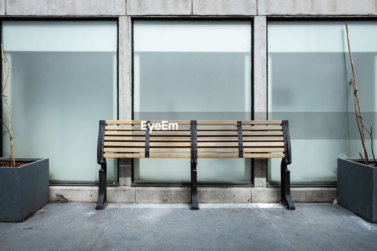 Empty chairs against wall