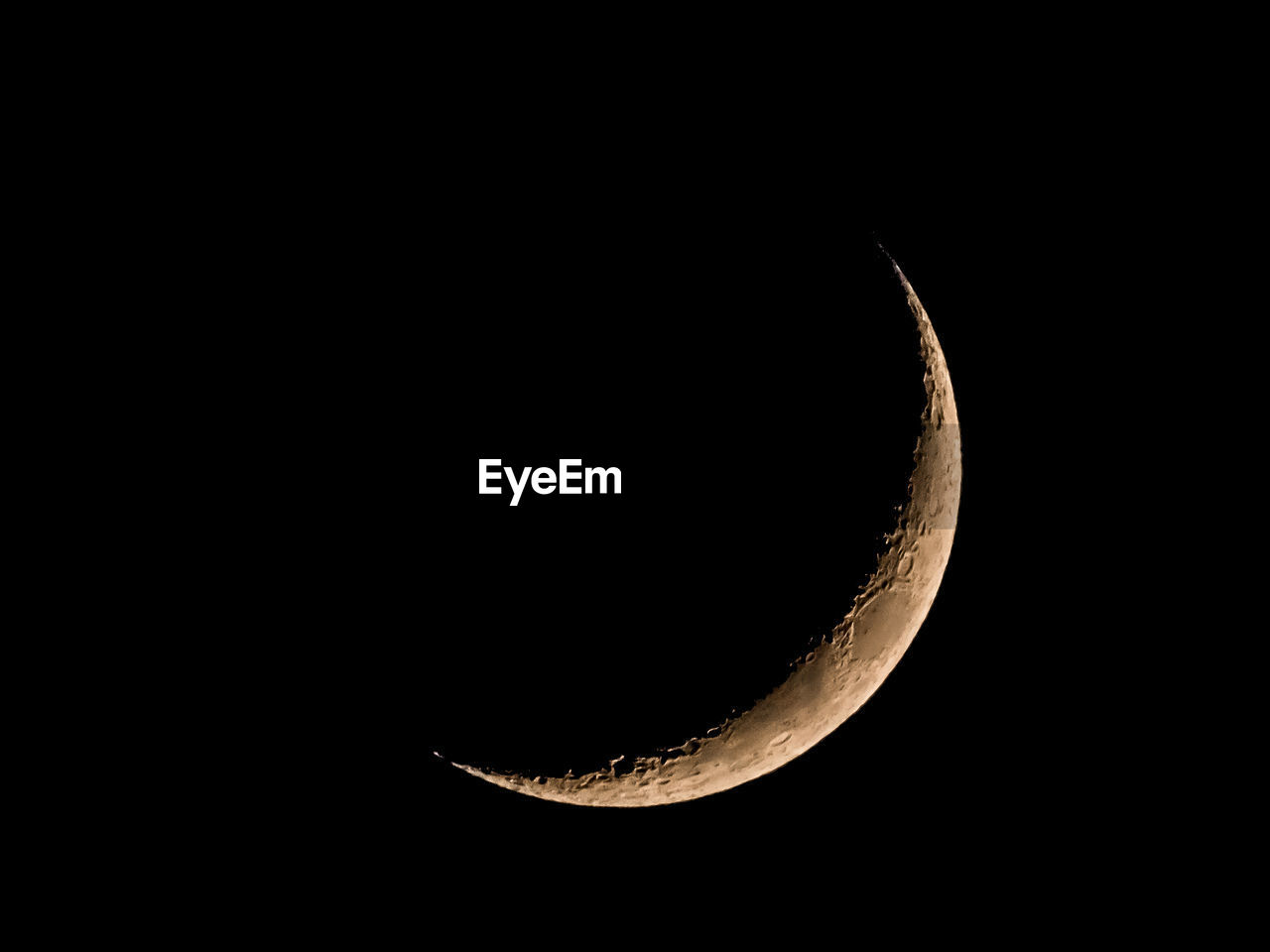 LOW ANGLE VIEW OF MOON AGAINST BLACK BACKGROUND