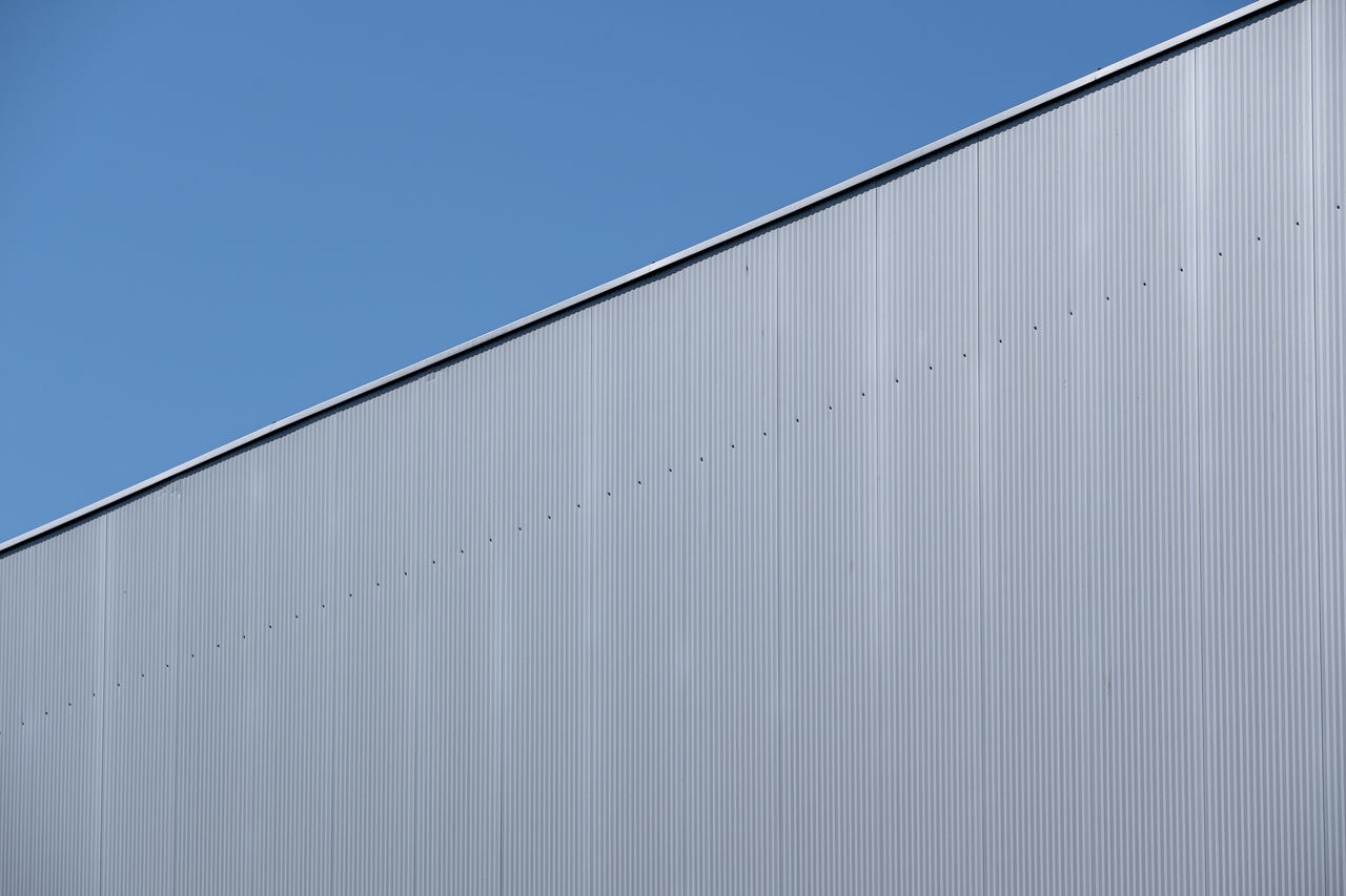 Low angle view of building against blue sky