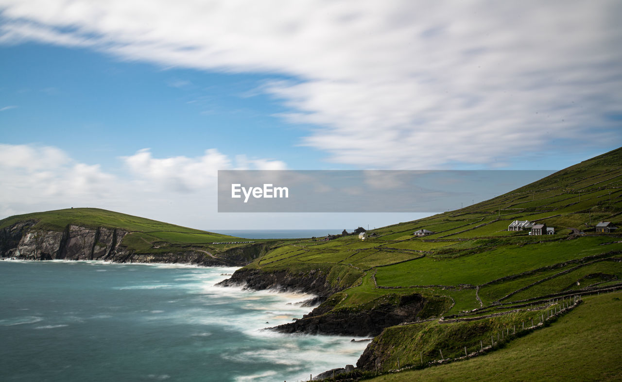 SCENIC VIEW OF SEA AND MOUNTAIN AGAINST SKY