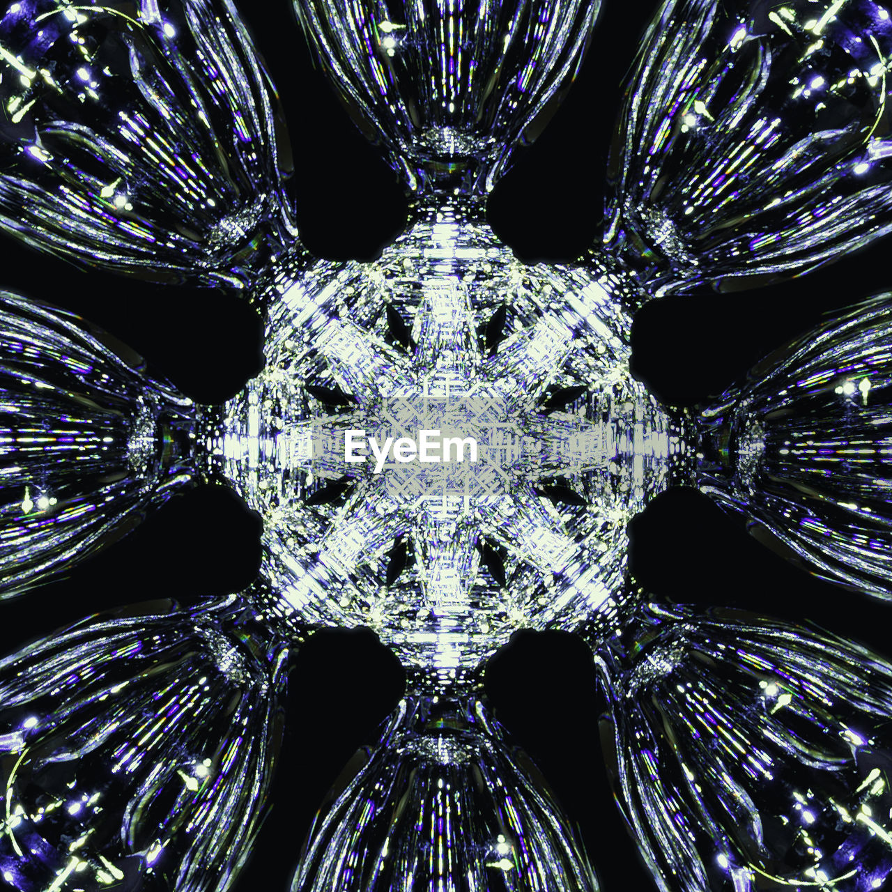 LOW ANGLE VIEW OF ILLUMINATED CHANDELIER AGAINST SKY