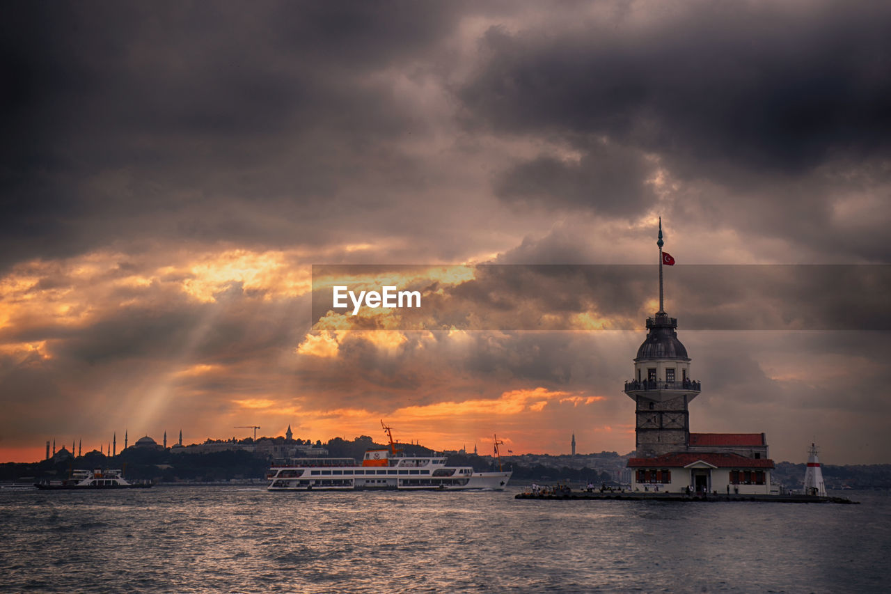 Scenic view of sea and buildings against sky during sunset. maiden's tower in turkey.