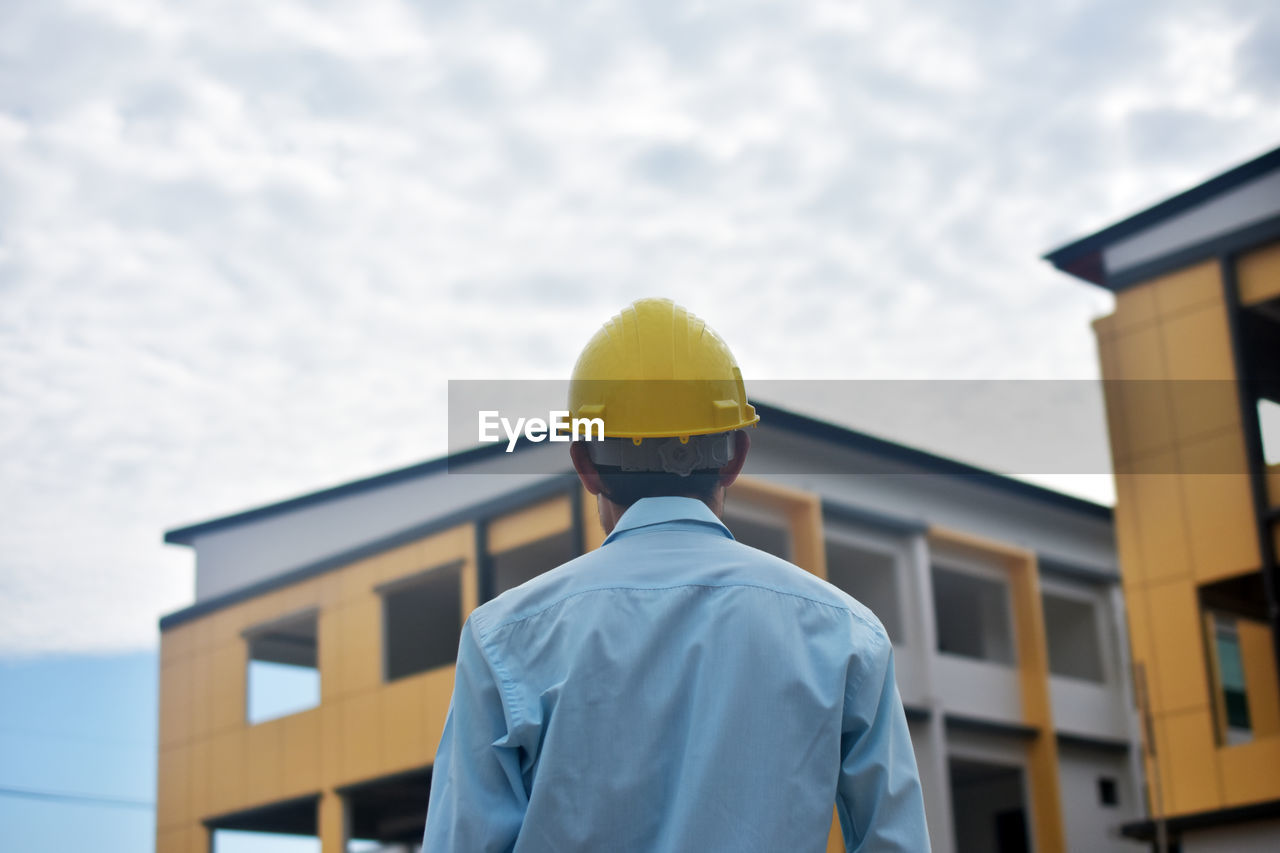 Engineer standing worker building estate construction background