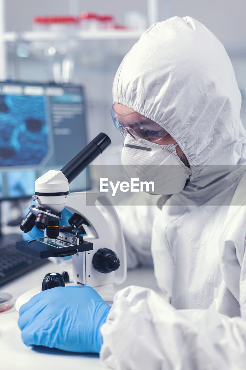 scientist examining patient in clinic