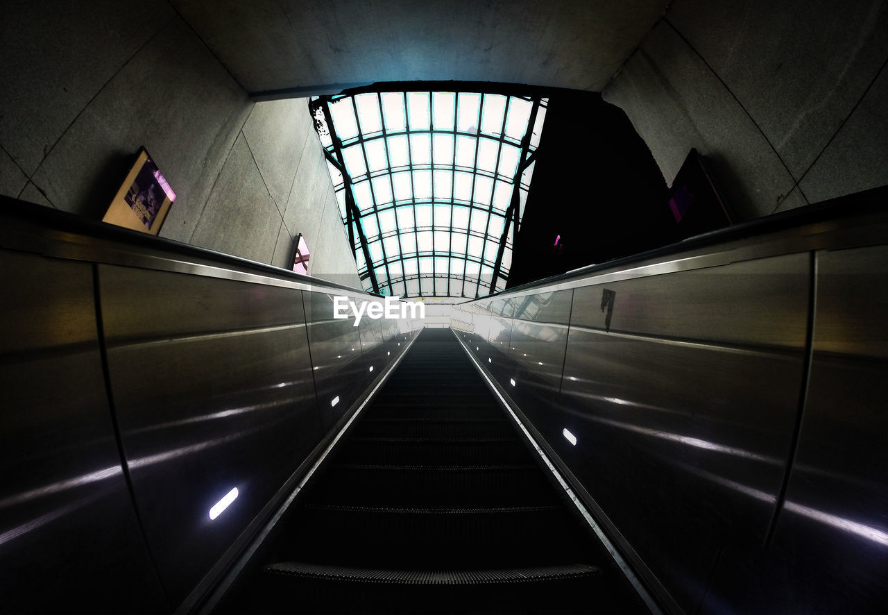 low angle view of illuminated escalator