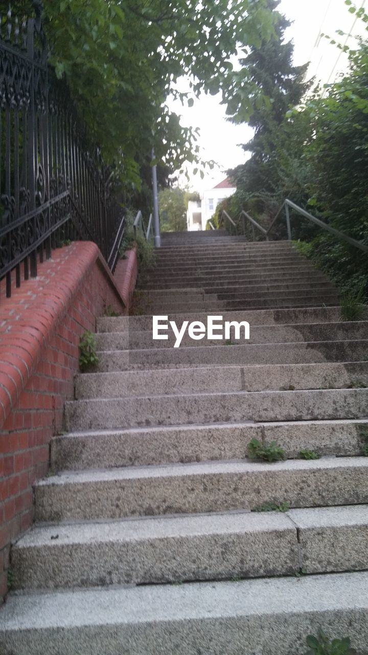 LOW ANGLE VIEW OF STAIRS LEADING TO STAIRCASE