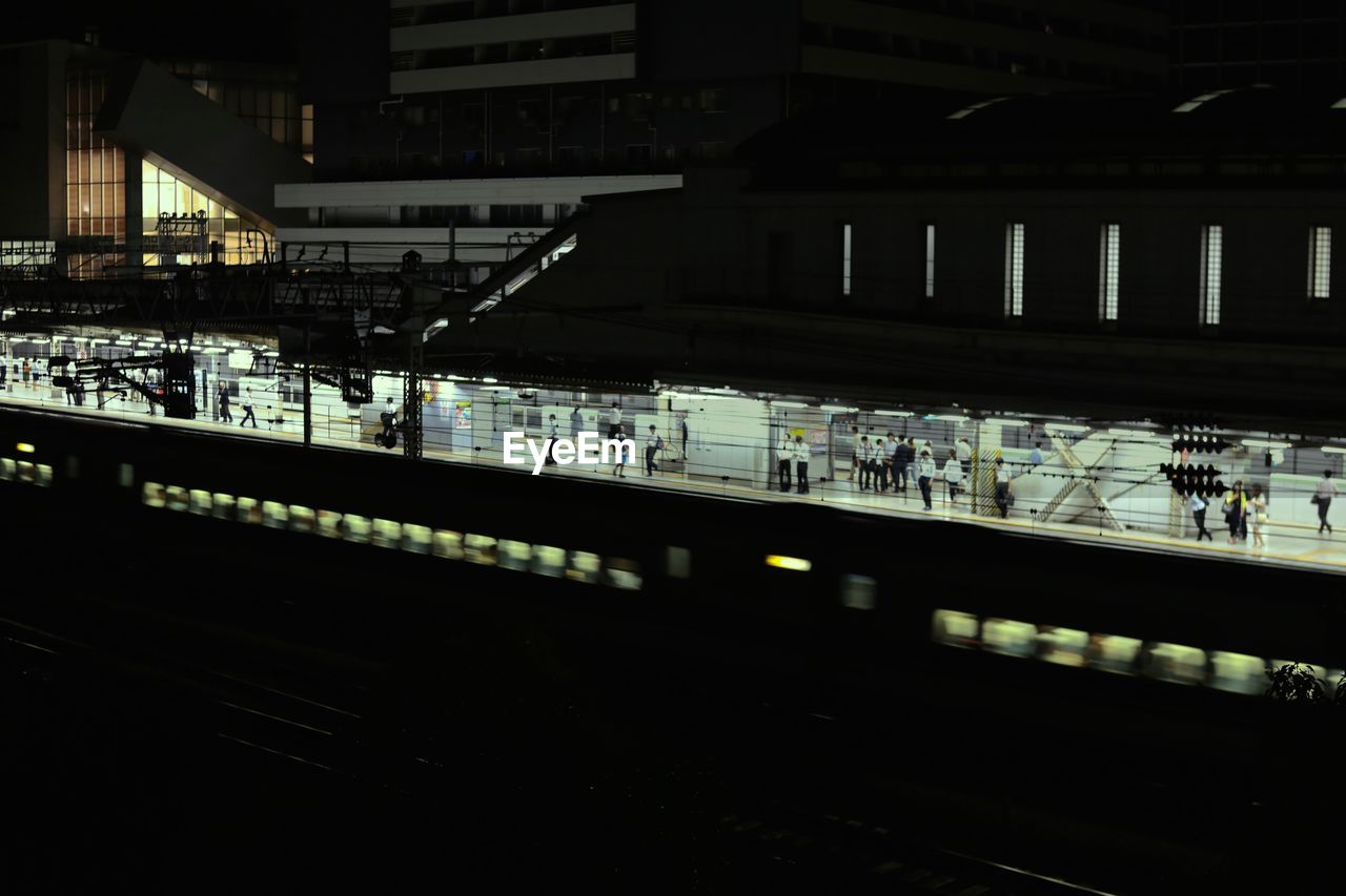 People waiting on railway station platform