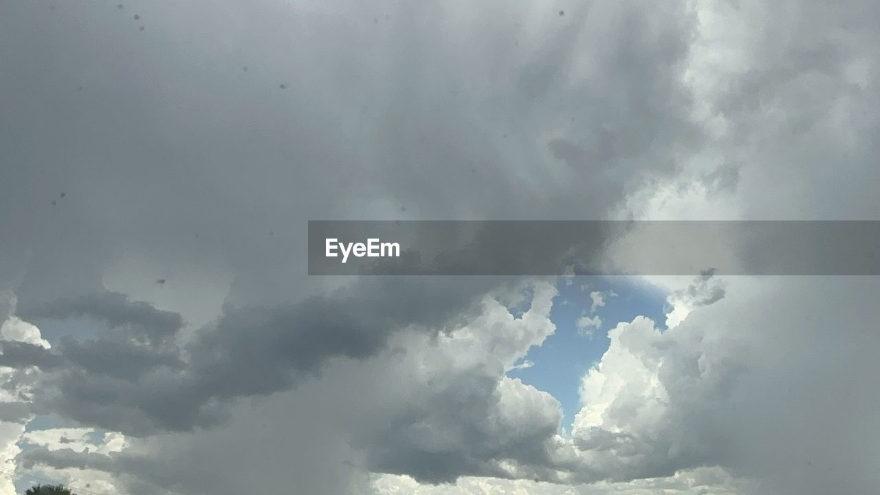 sky, cloud, nature, storm, beauty in nature, environment, no people, storm cloud, cloudscape, thunderstorm, dramatic sky, day, outdoors, scenics - nature, backgrounds, wet, overcast, sunlight, white