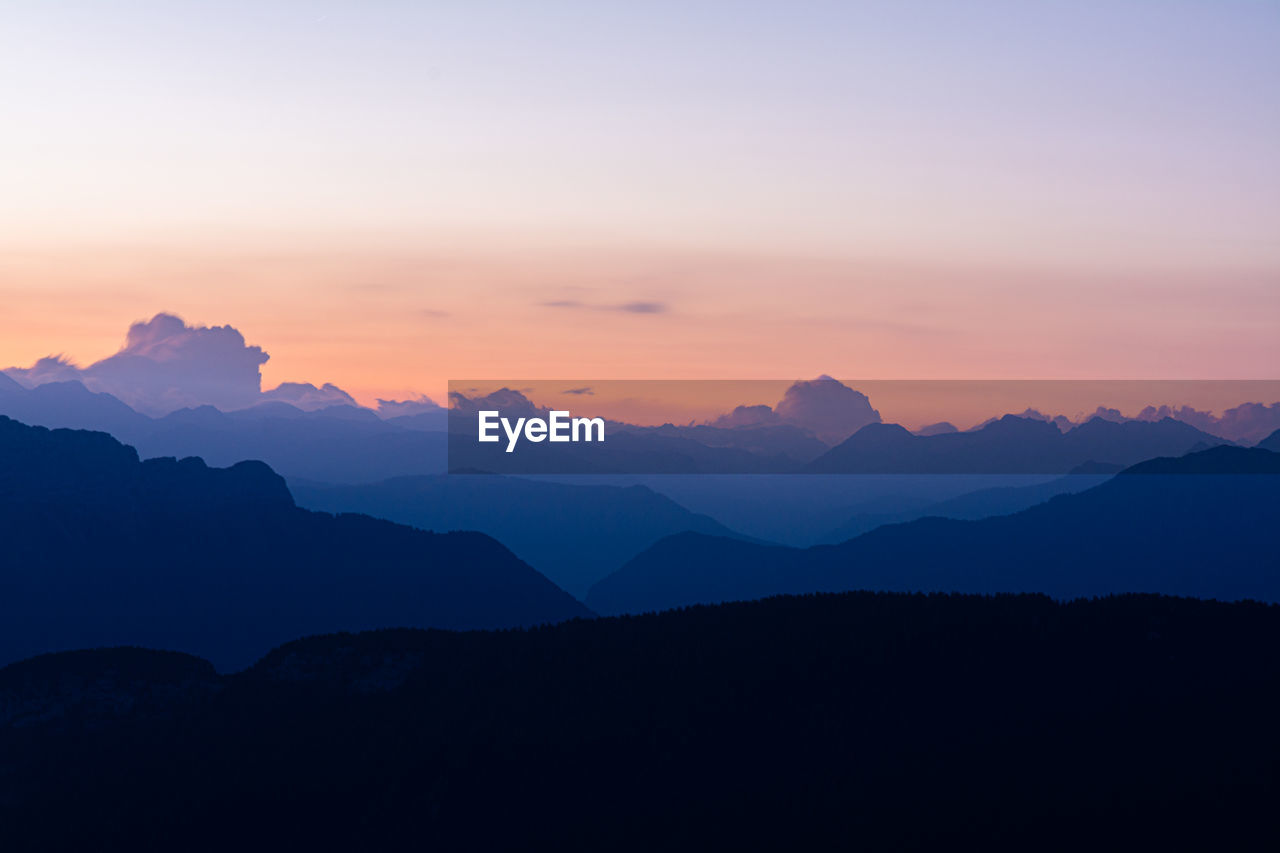 scenic view of silhouette mountain against sky during sunset