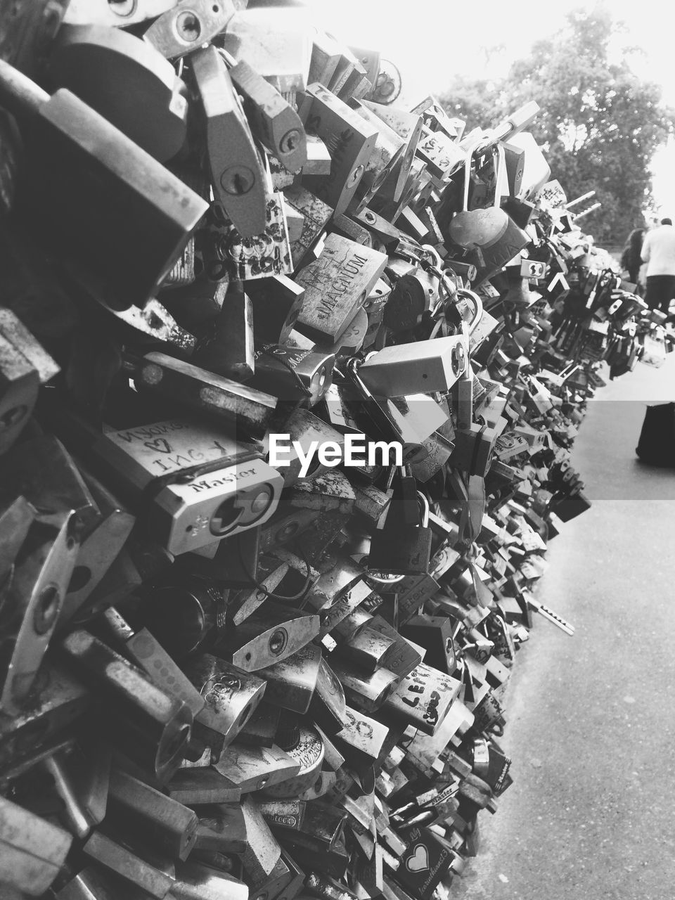 Close-up of padlocks hanging on railing