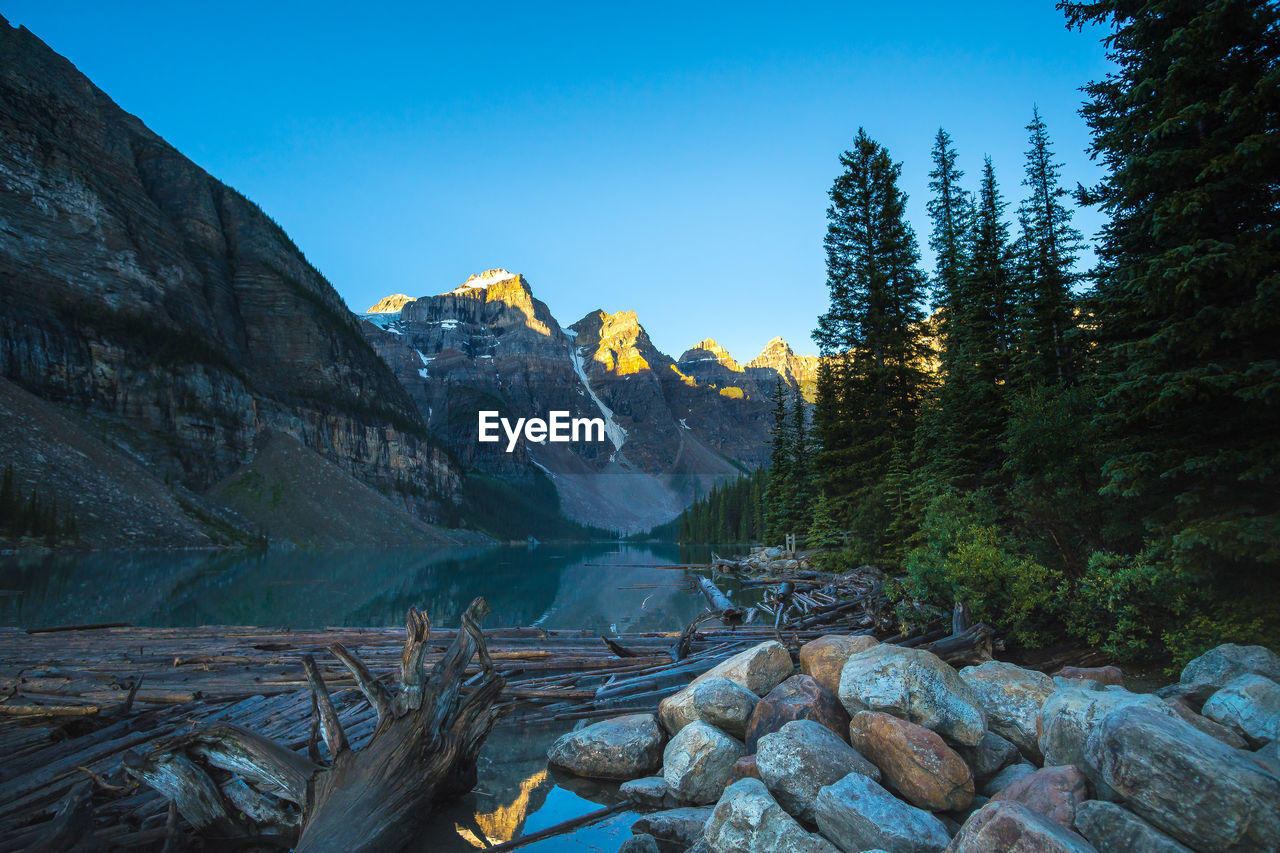 Scenic view of mountains against clear blue sky