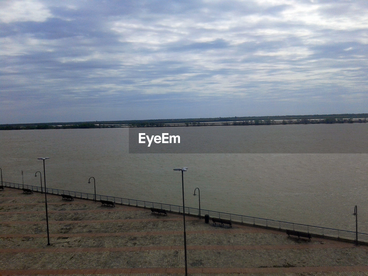 VIEW OF CALM SEA AGAINST SKY