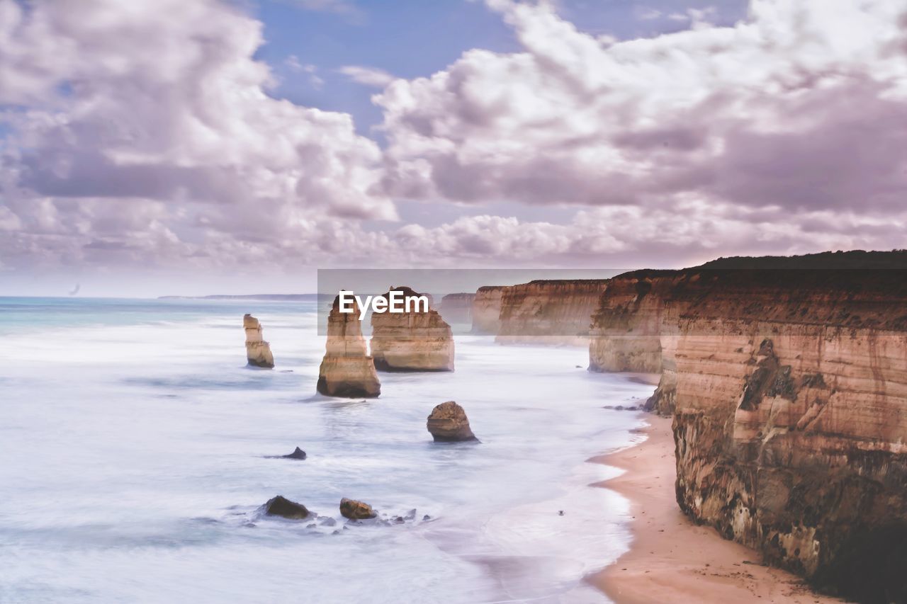 Twelve apostles against cloudy sky