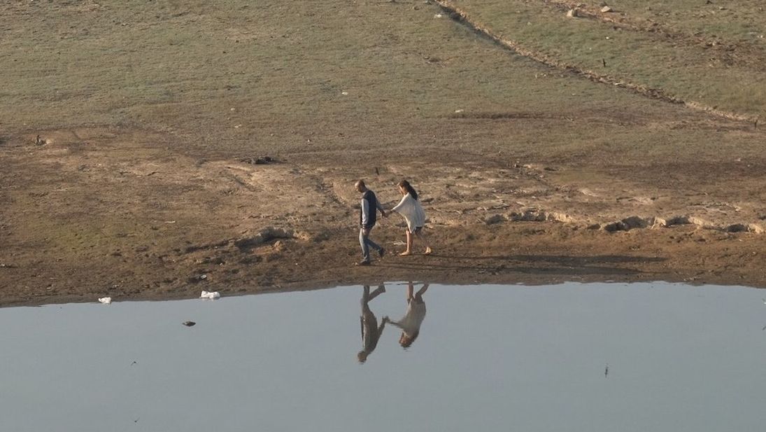 WOMAN STANDING ON LANDSCAPE