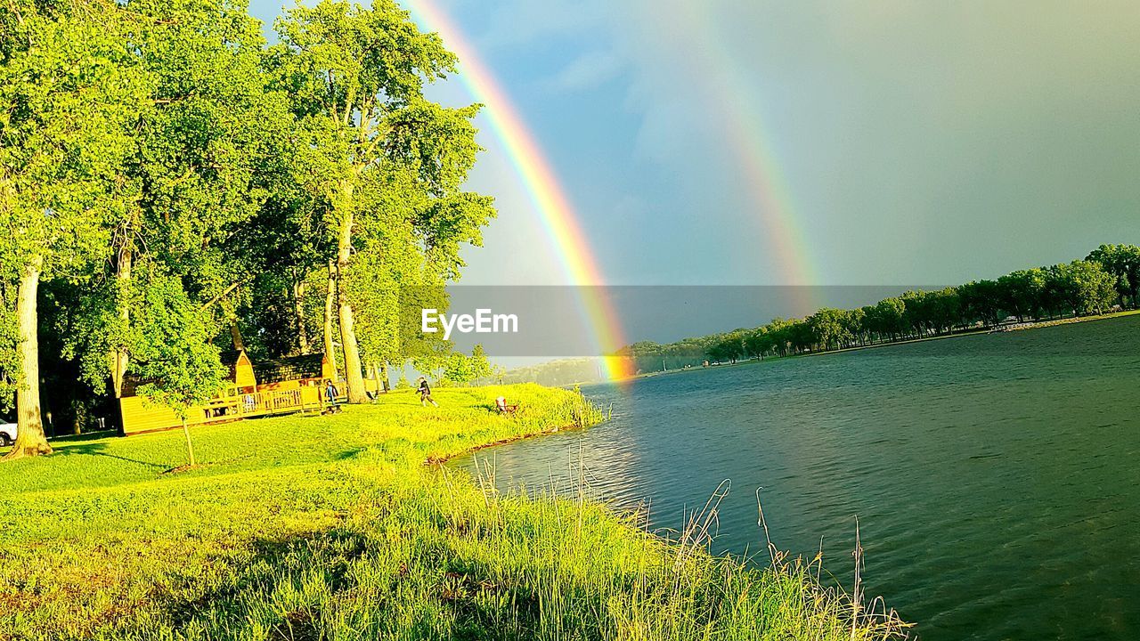 SCENIC VIEW OF RAINBOW OVER RIVER