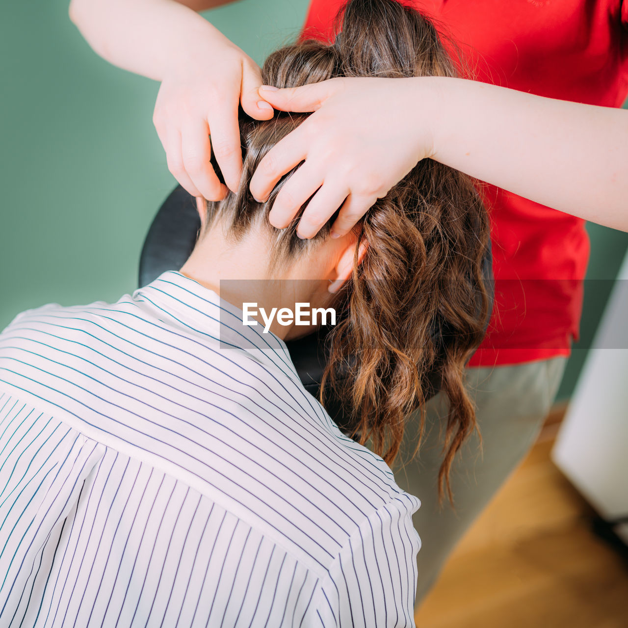 Chair massage in the office. female sitting in her office on a portable massage chair