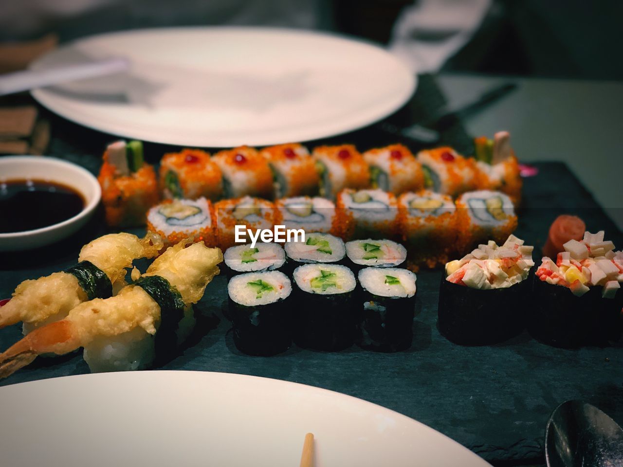 Close-up of sushi on tray in restaurant