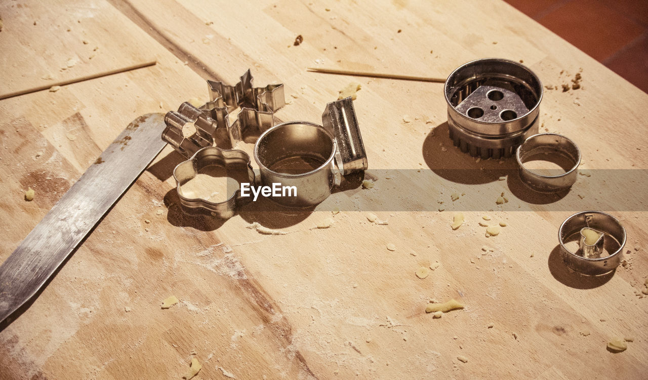 High angle view of rusty machinery on table