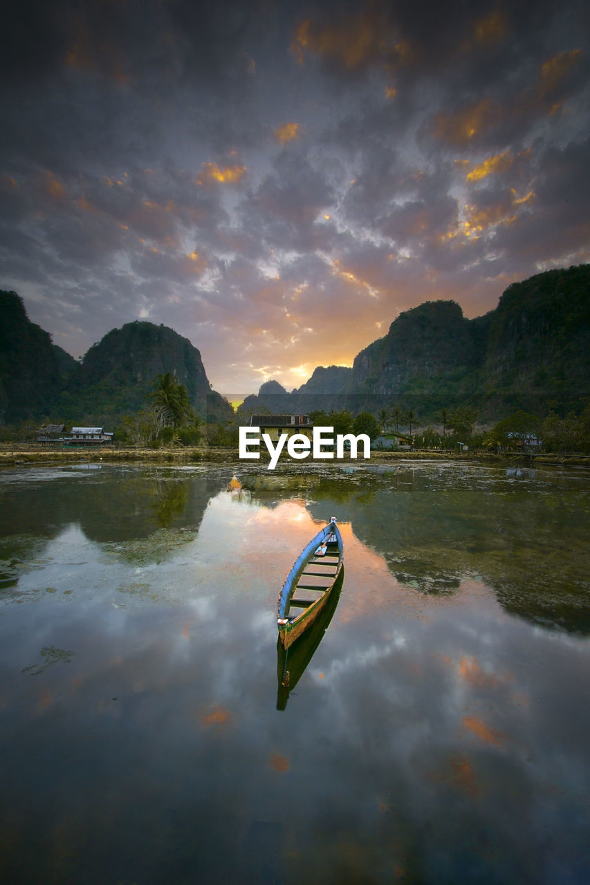 Scenic view of lake against sky during sunrise