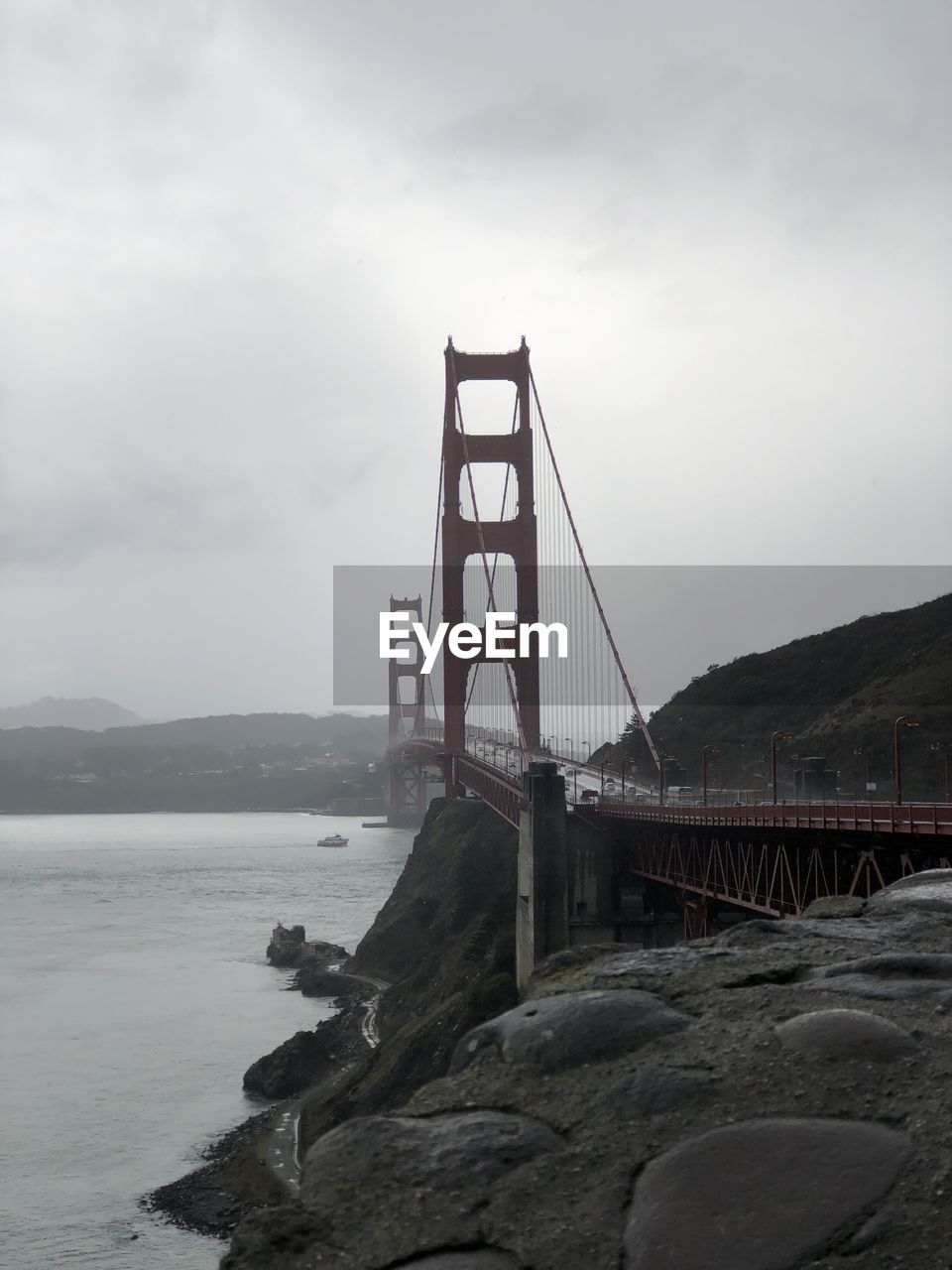 View of suspension bridge over sea