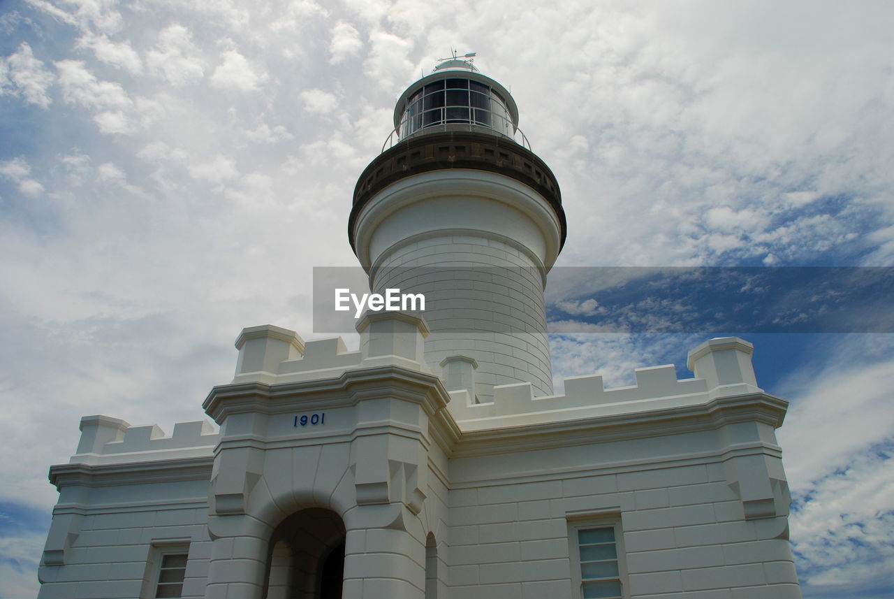 Low angle view of cape byron lighthouse against cloudy sky