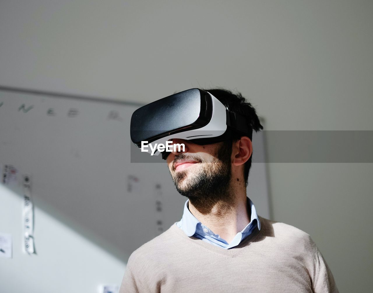 Portrait of man wearing virtual reality glasses