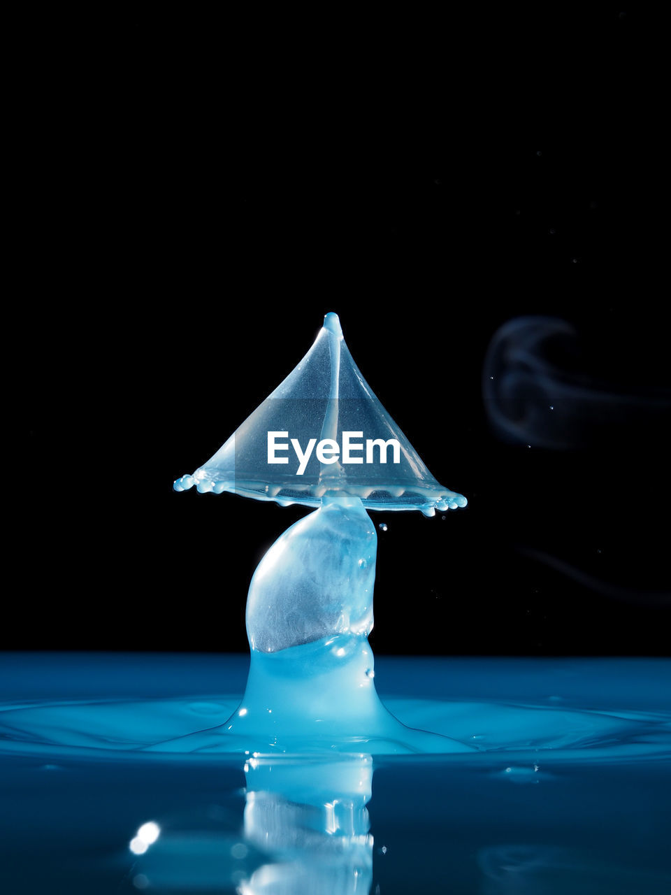 Close-up of water splashing against black background