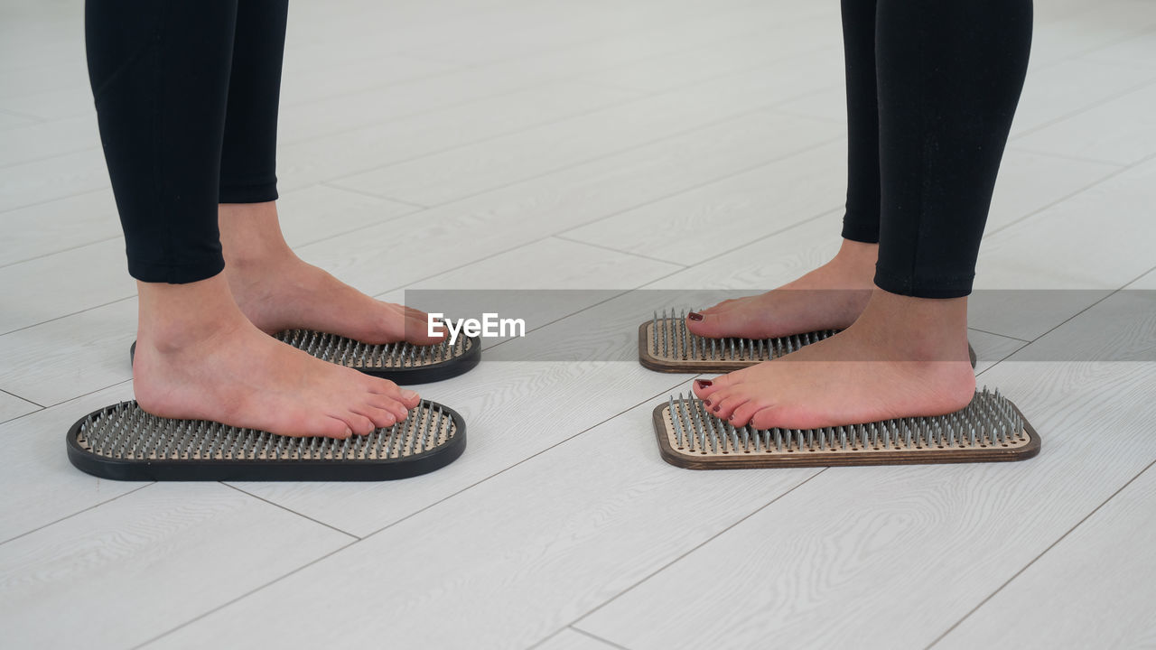 low section of woman standing on floor